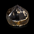Front view of a unique black and cream semi-polished agate point with natural banding, polished apex and rough base on a black background