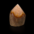 Front view of a unique semi-polished agate point with warm natural banding, rough base and polished apex on a black background