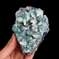 Amethyst with Manganocalcite cluster front view, showing raw crystal texture, pale mineral points and purple amethyst edges