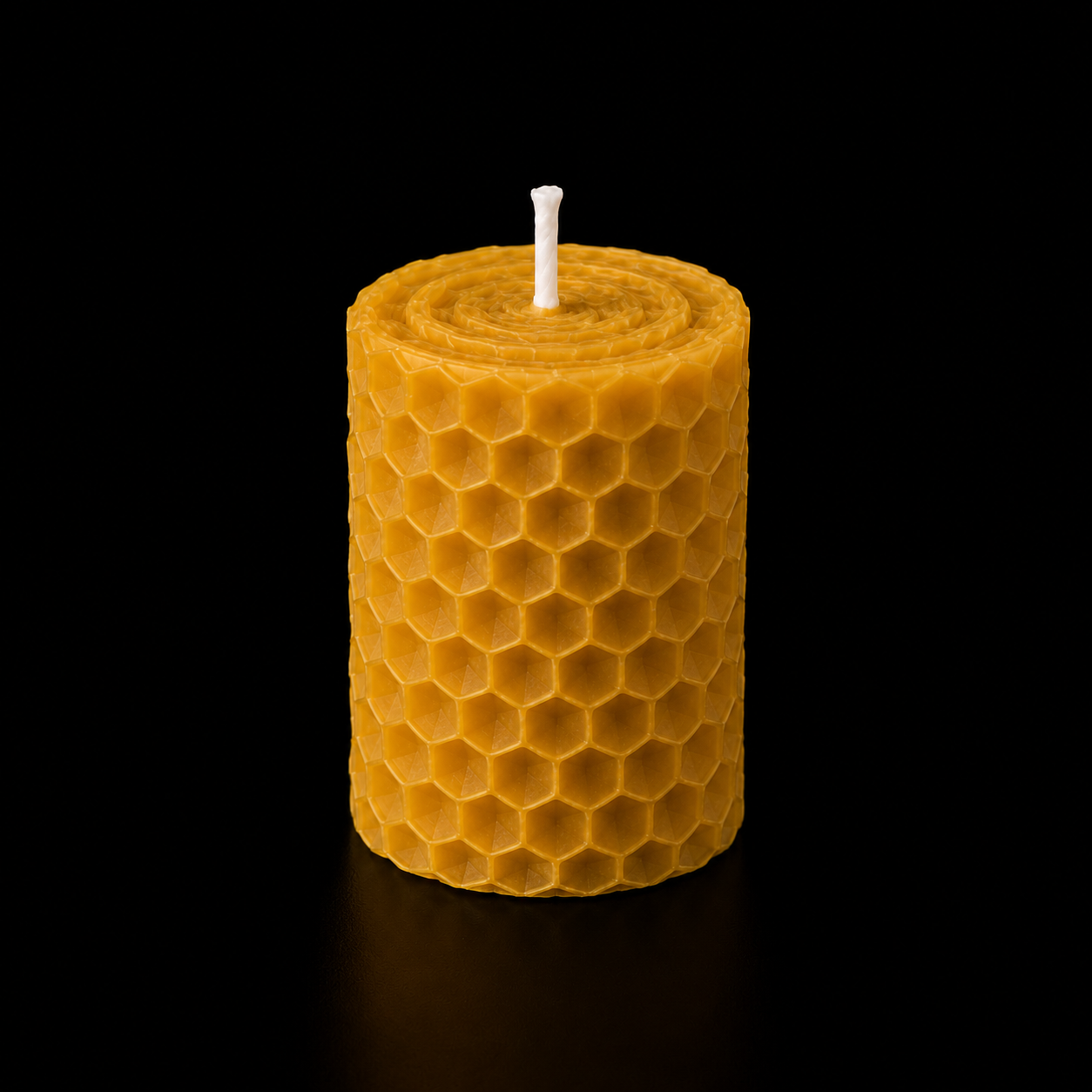 Handmade beeswax pillar honey candle with honeycomb texture and natural golden colour