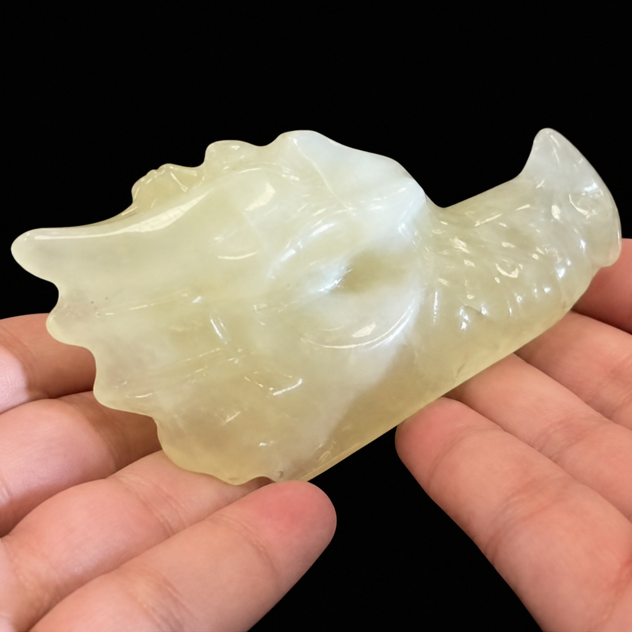 Citrine dragon head carving close side detail, showing sculpted scales, horn shape and glossy polished finish