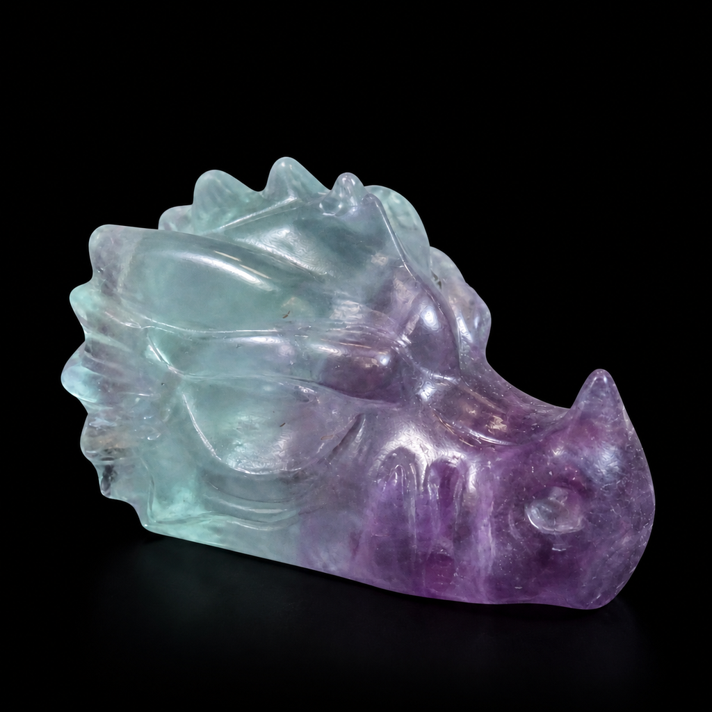 Fluorite dragon head carving side view showing purple snout, blue-green body and polished carved details