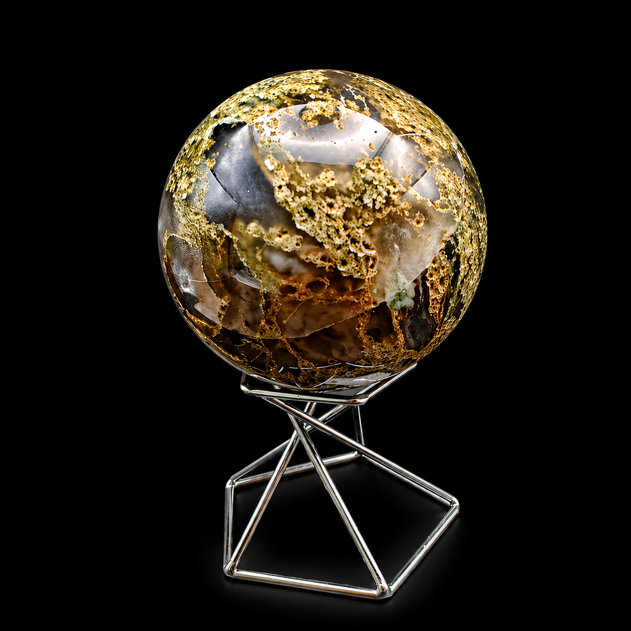 Front view of a polished moss agate sphere 365g with golden scenic inclusions, smoky brown areas and creamy white crystal-like natural details on a metal stand