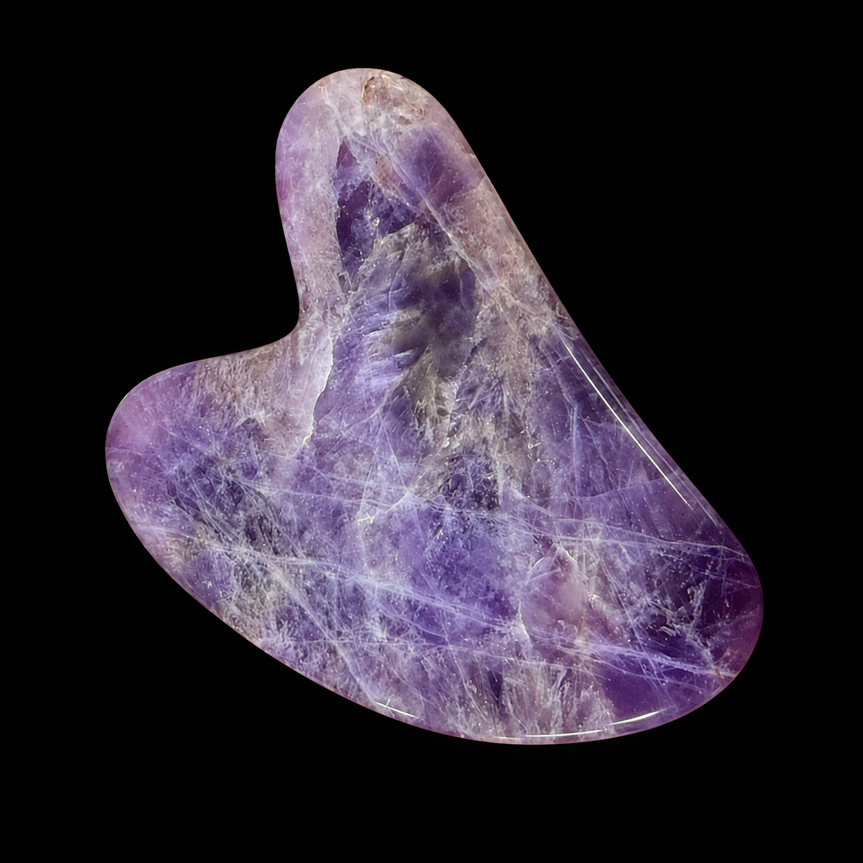 Polished amethyst Gua Sha tool, front angled view showing purple tones, white veining and smooth curved massage shape.