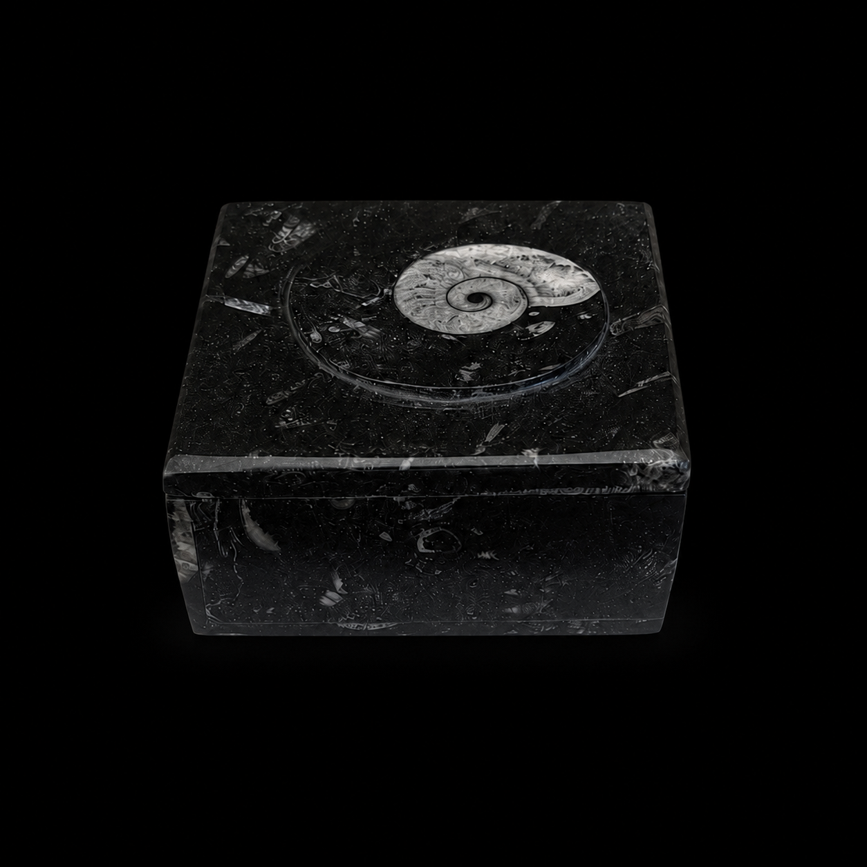 Front view of square fossil jasper jewellery box with ammonite fossil detail on the lid